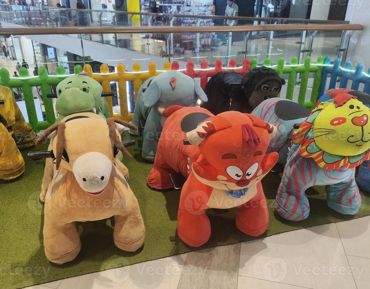 A group of stuffed animals in a store photo