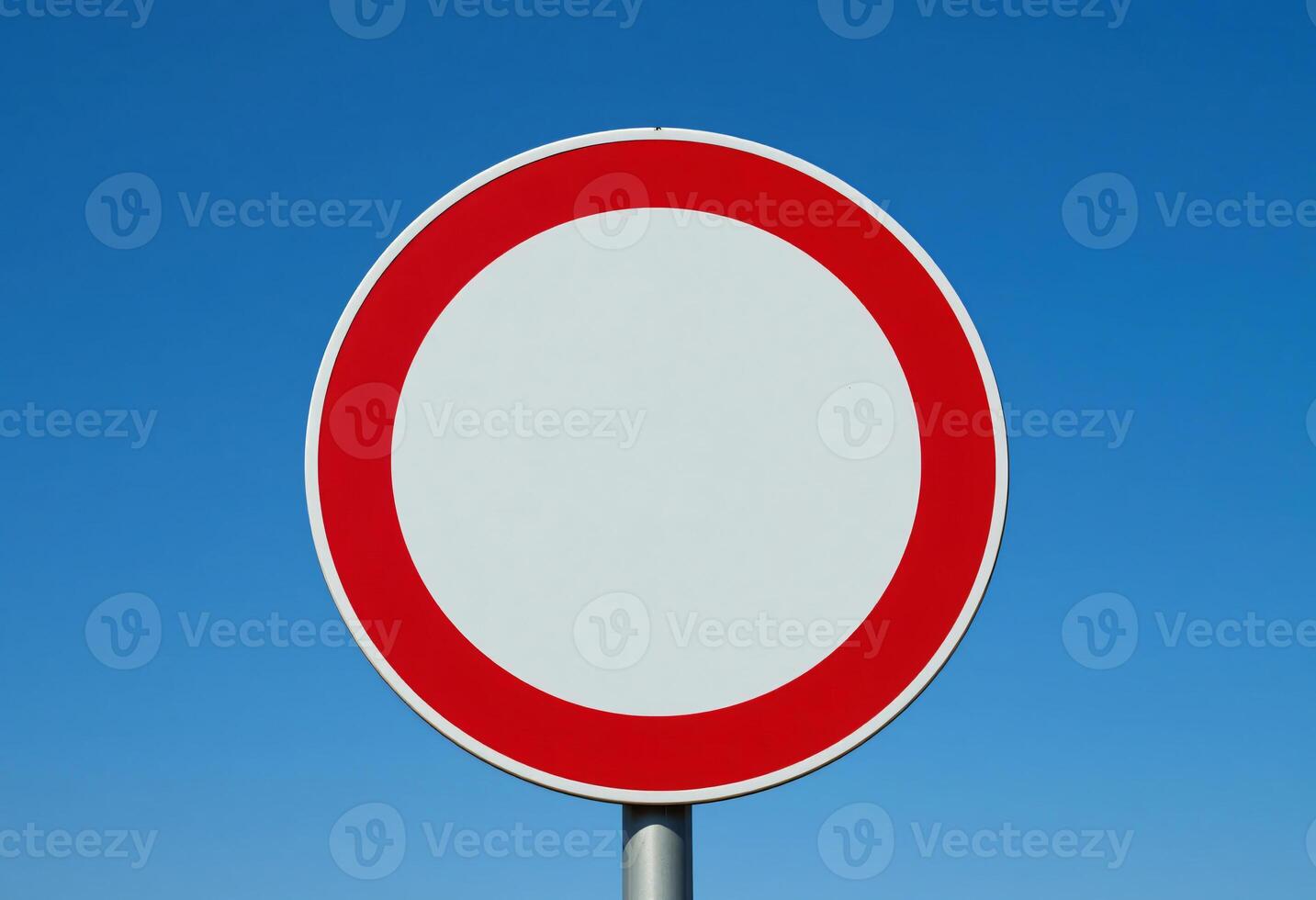 Blank circle red road sign with blue sky background photo
