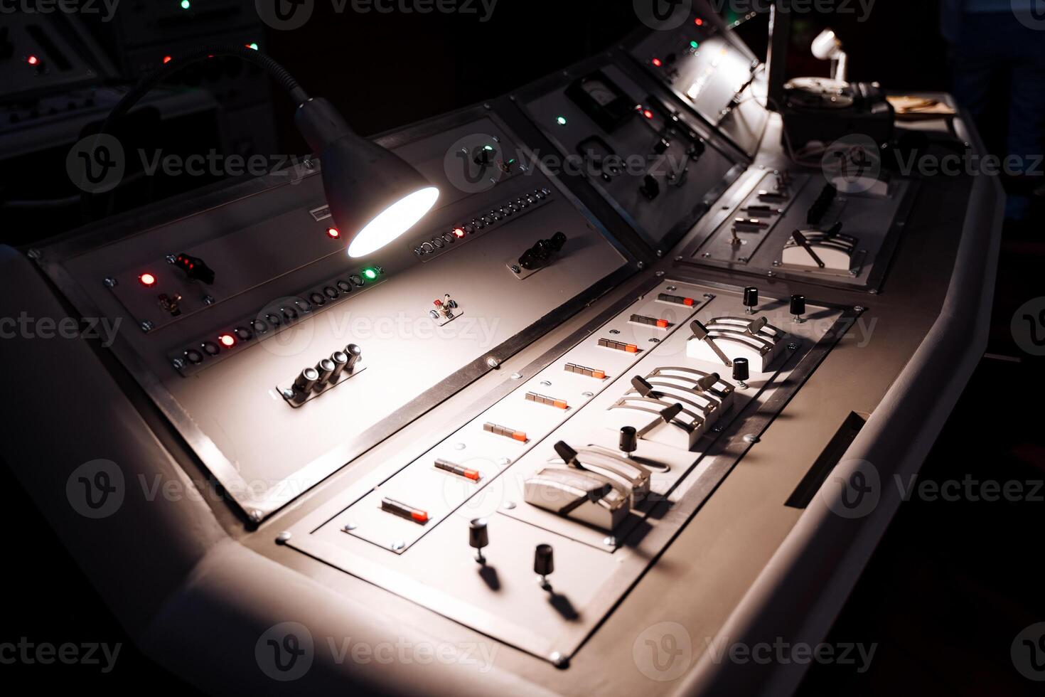 A control panel with lights and buttons on it photo