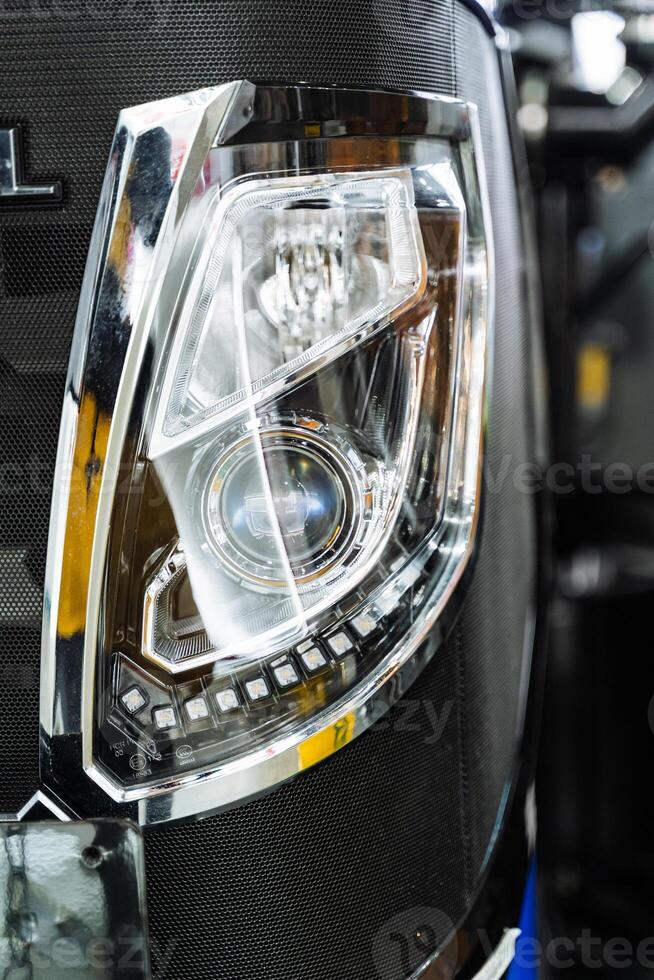 A close up of a car headlight photo