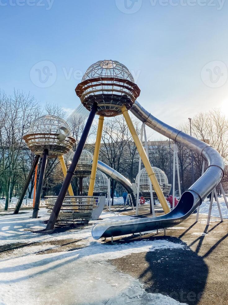 A playground with a slide and a slide photo