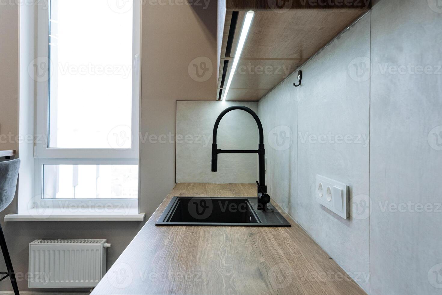 A welldesigned kitchen should include a functional sink, a highquality faucet, and a large, bright window that enhances its overall appeal, making it truly the heart of the home photo