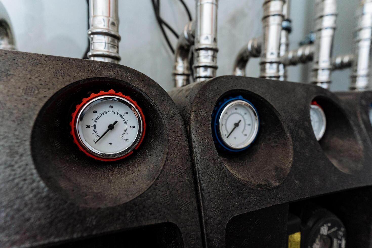 This image shows a closeup of two expertly mounted pressure gauges on a machine, highlighting their intricate design and functionality in accurately measuring pressure levels photo