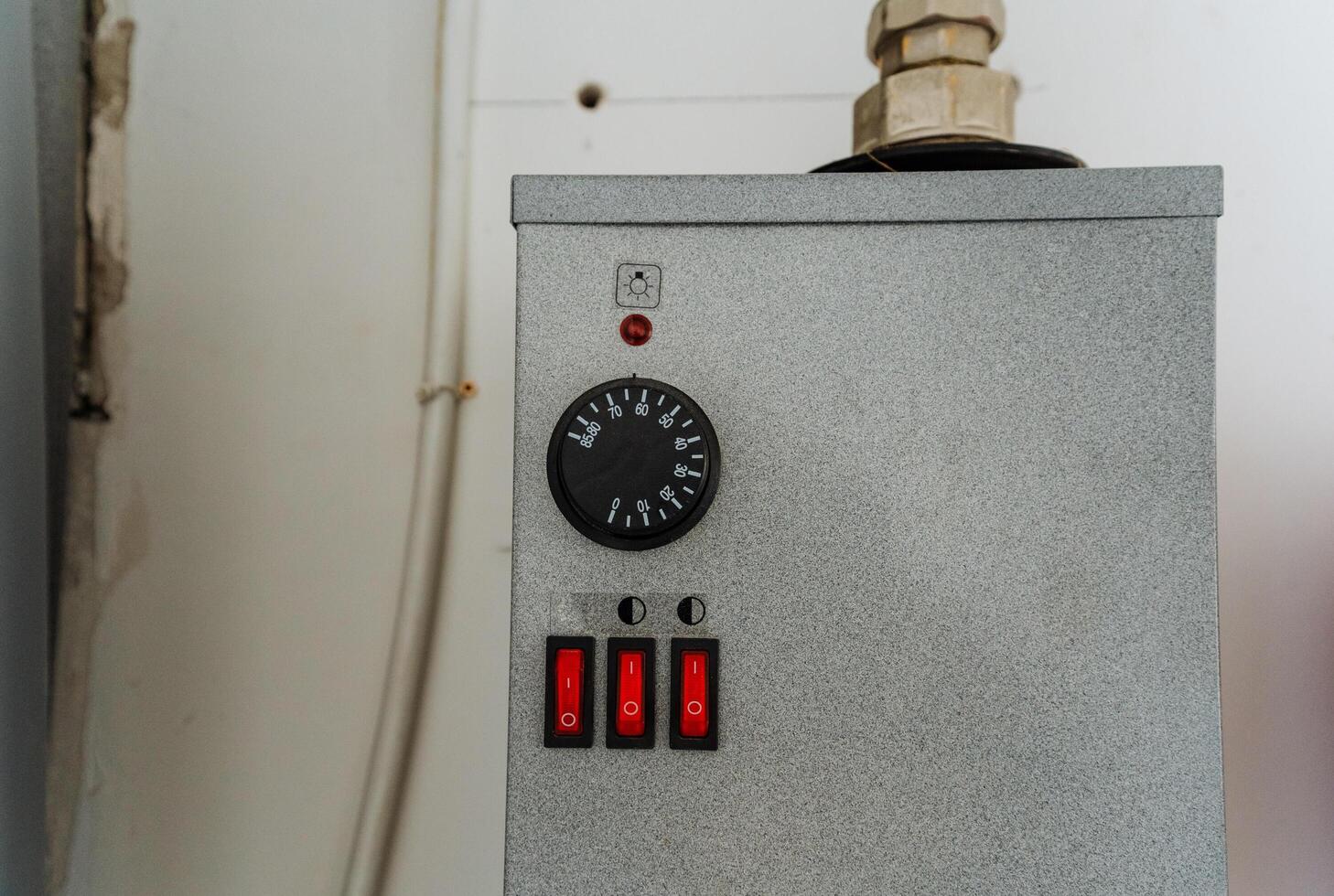 A close up of a thermostat on a wall photo