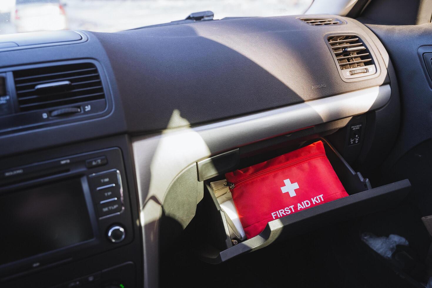 A wellstocked first aid kit placed conveniently in the cars glove box ensures quick and easy access for medical emergencies that may arise during your travels and road trips photo