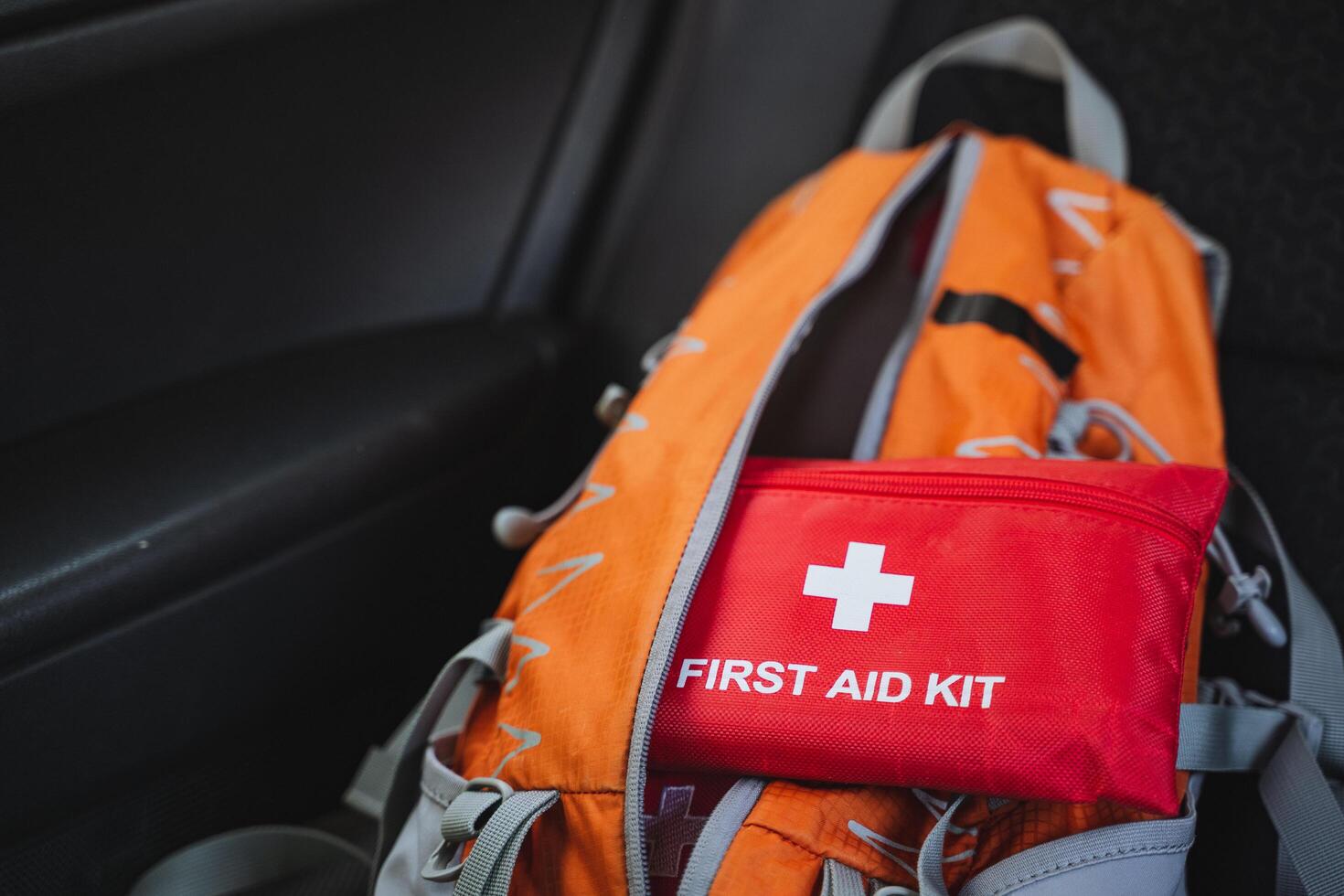 The Essential Orange Backpack comes equipped with a comprehensive First Aid Kit, making it perfect for outdoor activities and ensuring your emergency preparedness is topnotch photo