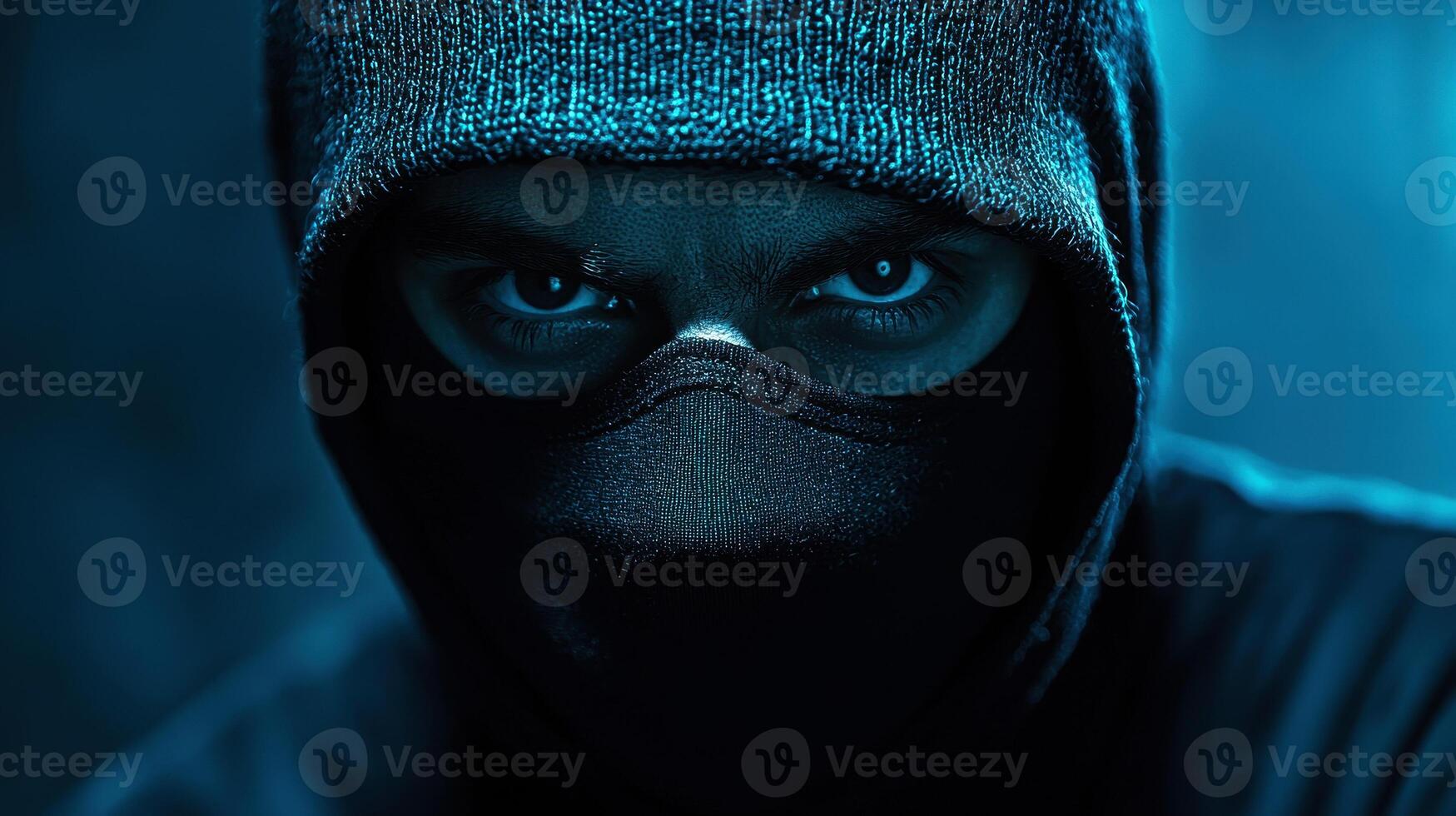 man wearing a black mask and a suit on dark blue isolated background.. photo