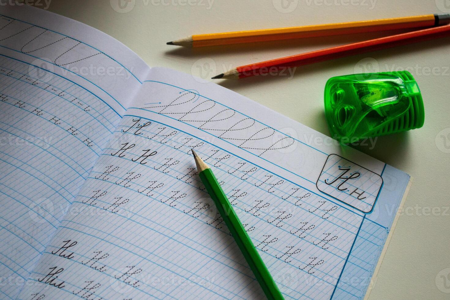 Back to school, View of pen and pencils on a school notebook, notebook and pencils photo