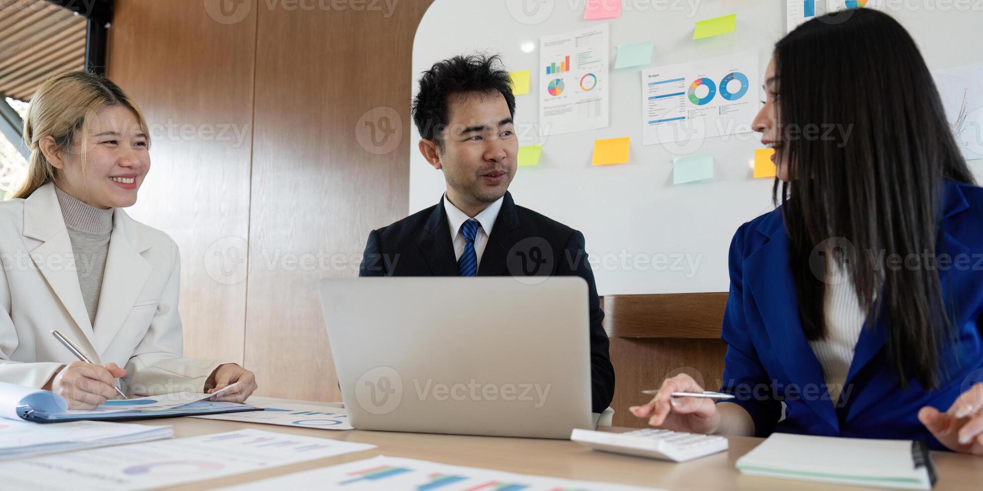 Collaborative business team discussing analysis and insights during a strategy meeting in a modern office. photo