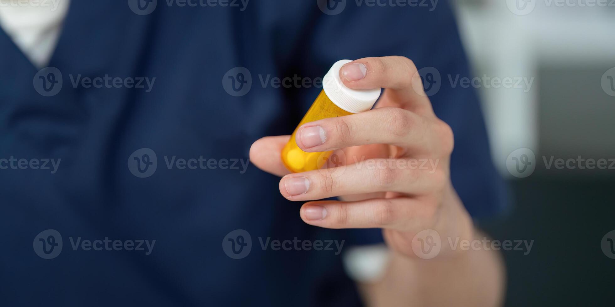 Medical student analyzing medication dosage with a prescription bottle, focusing on pharmaceutical education. photo