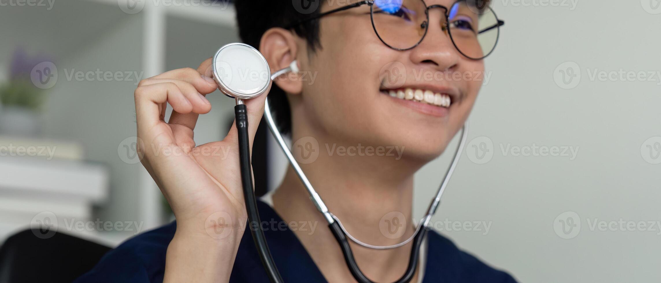 Medical student smiling while holding a stethoscope, showcasing enthusiasm for healthcare. photo