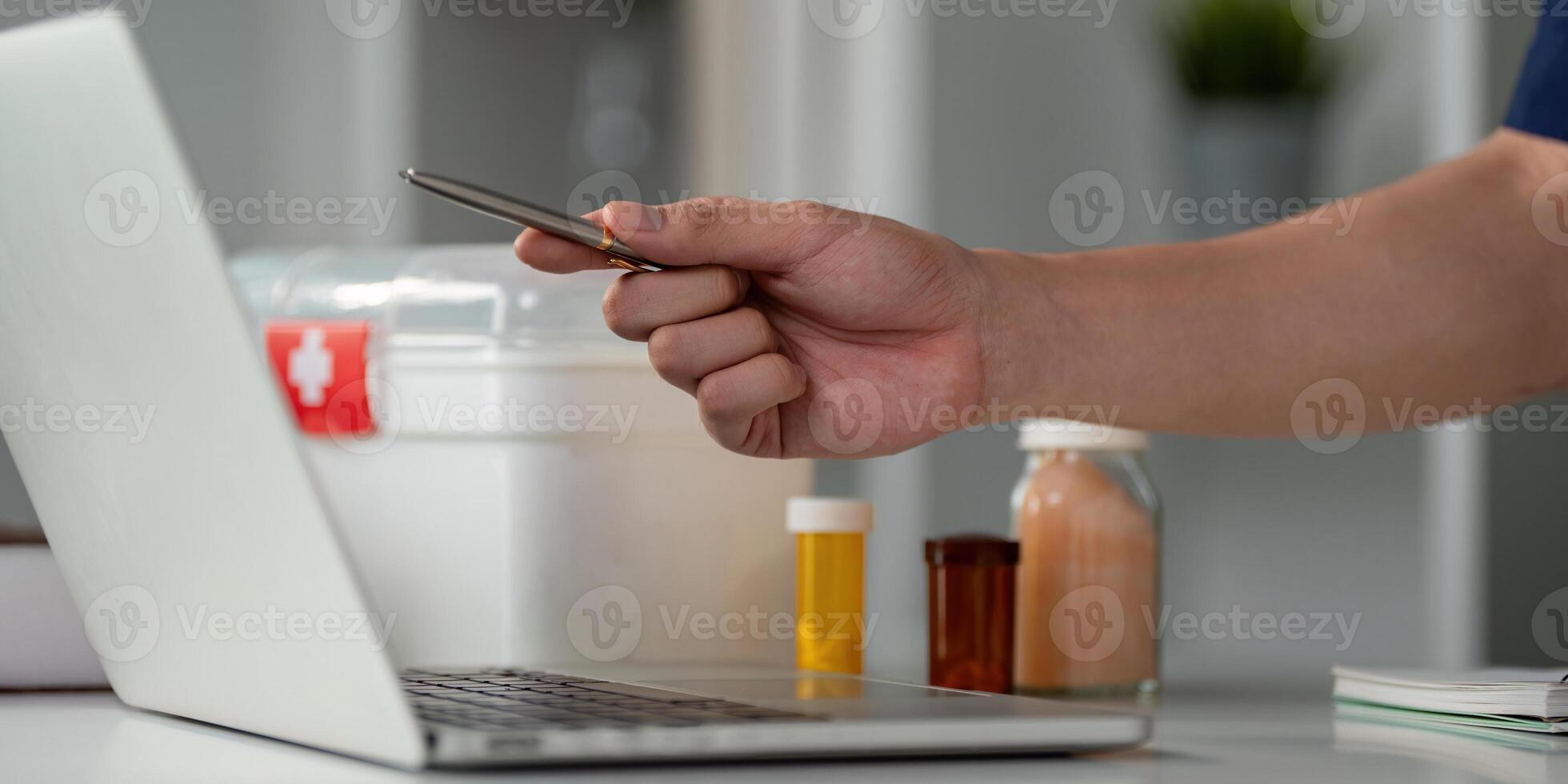 Healthcare professional managing medication and technology in a modern workspace, illustrating contemporary medical practices. photo