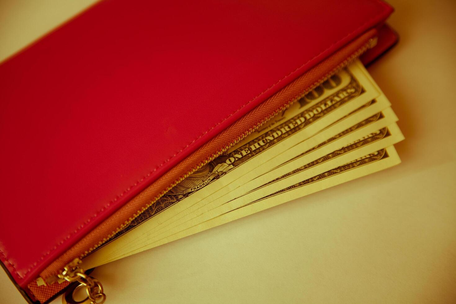 A red wallet with money inside photo