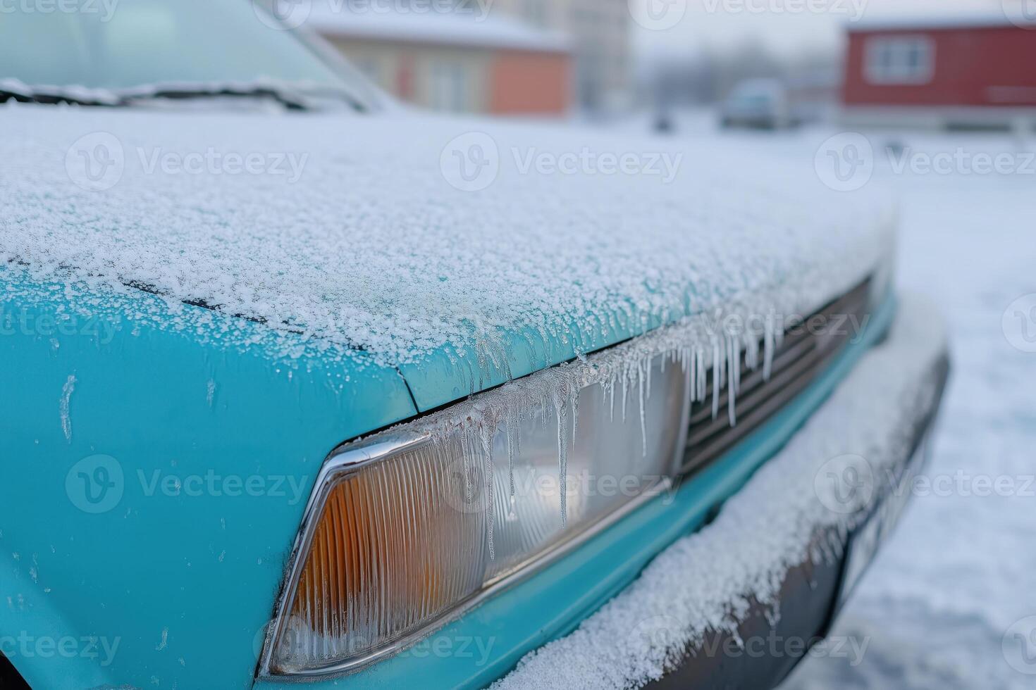Close-up of an old blue car covered with snow in winter photo