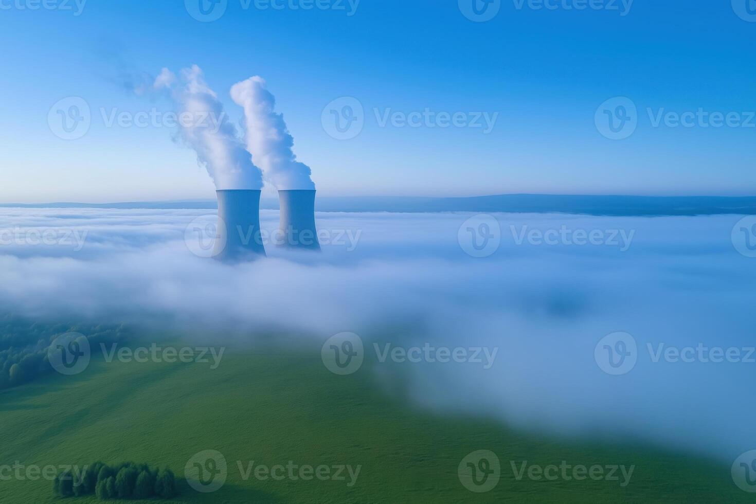 Cooling towers of nuclear power plant in the clouds, aerial view photo