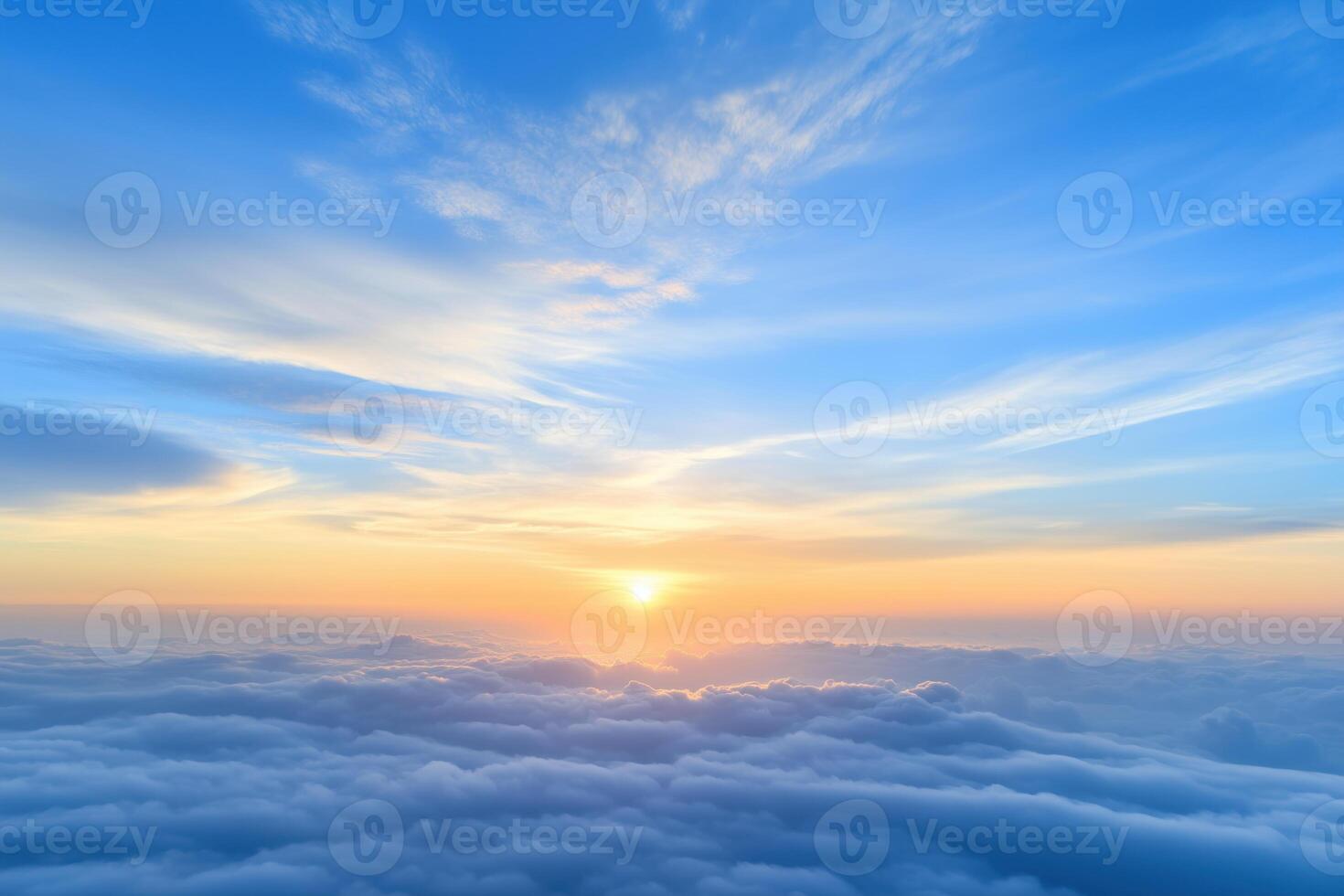 Sunrise over the clouds. View from the window of an airplane. photo