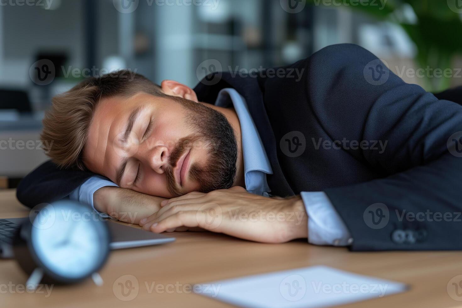 tired businessman sleeping at workplace in office. exhausted businessman sleeping at workplace photo