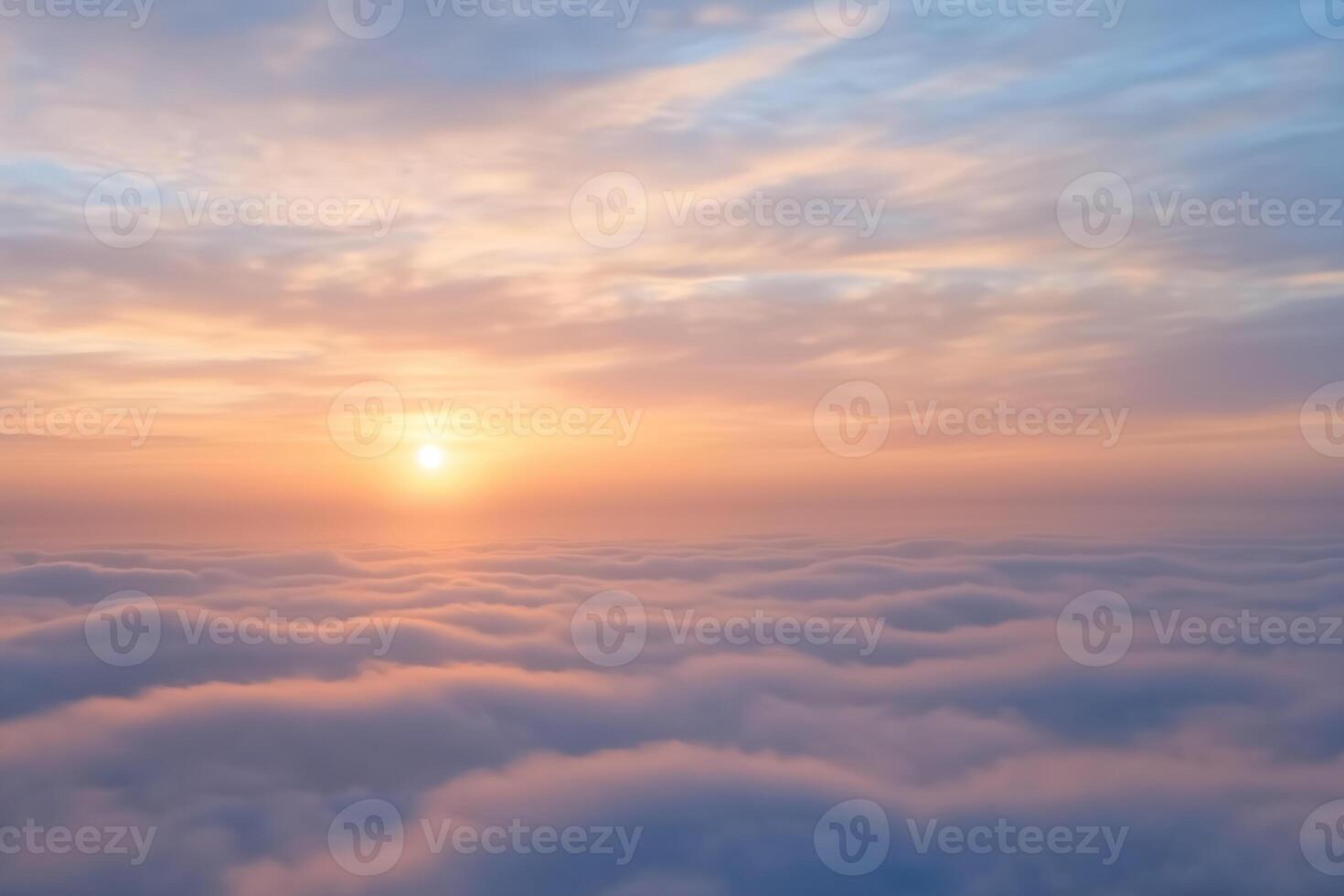 Sunset over the clouds. Background. View from the window of an airplane photo