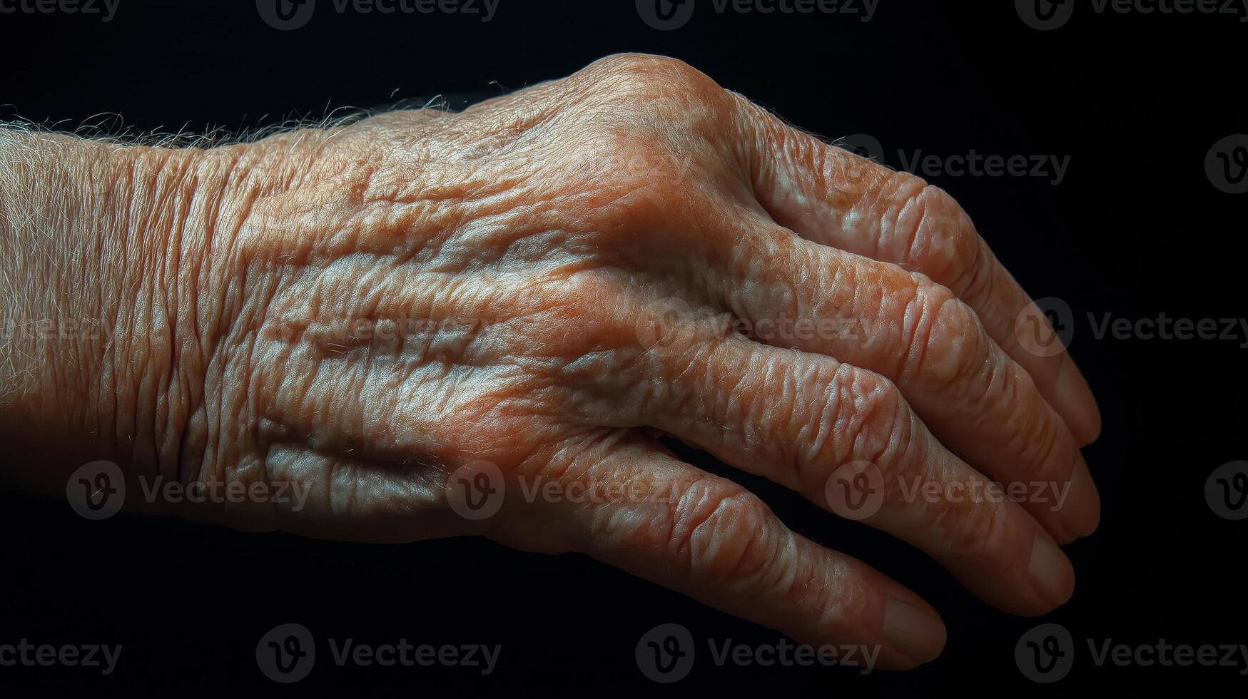 Close-up of an elderly hand showcasing age and experience with intricate details photo