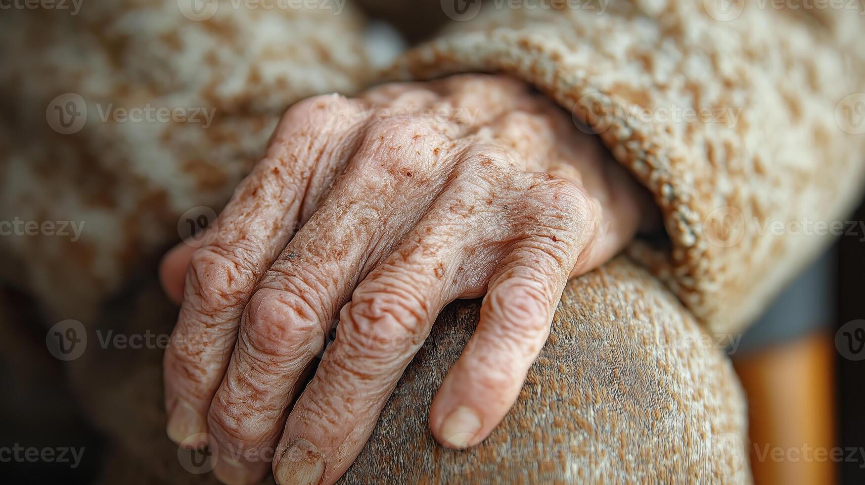Close-up of an old mans hand covered in age spots and visible veins photo
