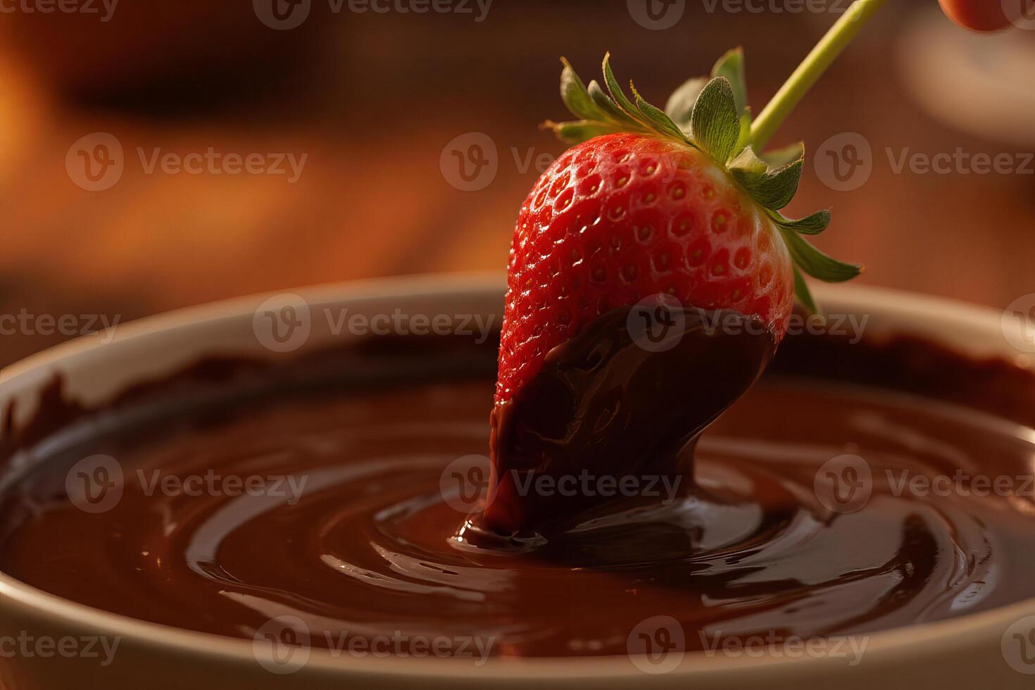 A strawberry dipped in chocolate, in a bowl photo