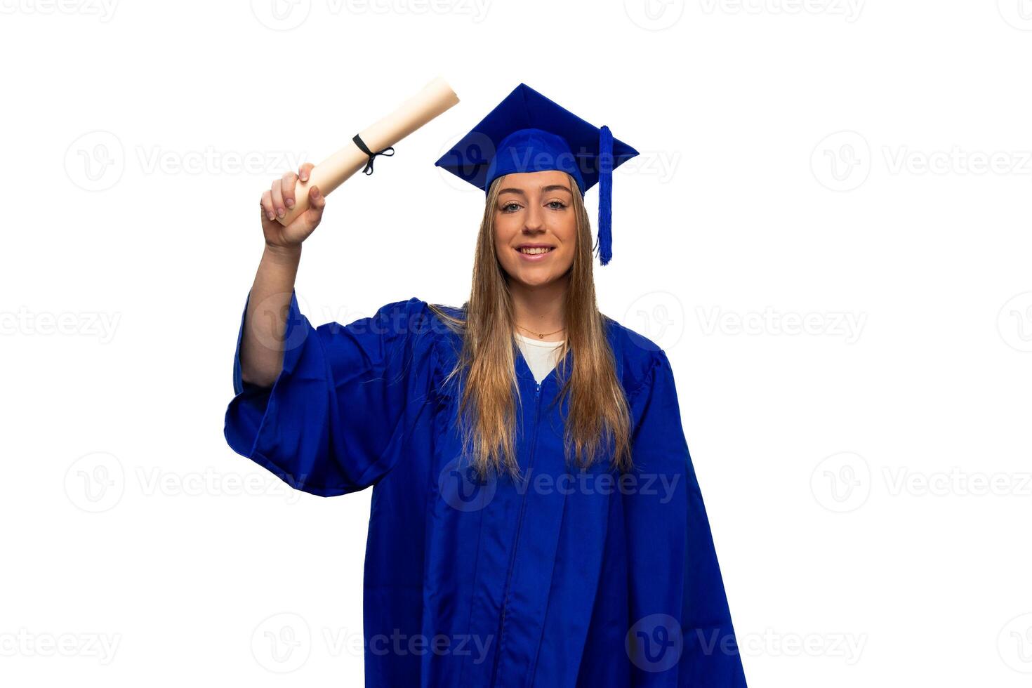 Graduating student wearing blue gown holding diploma celebrating graduation photo