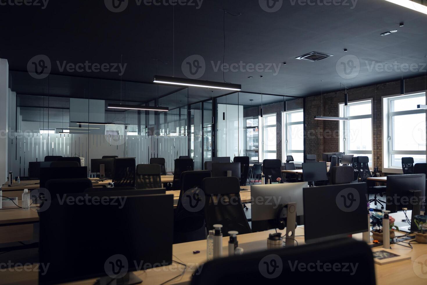 Modern business, glass-walled startup office, open and spacious workspace exudes a modern and innovative vibe, fostering a dynamic atmosphere that supports creativity, collaboration, and business photo