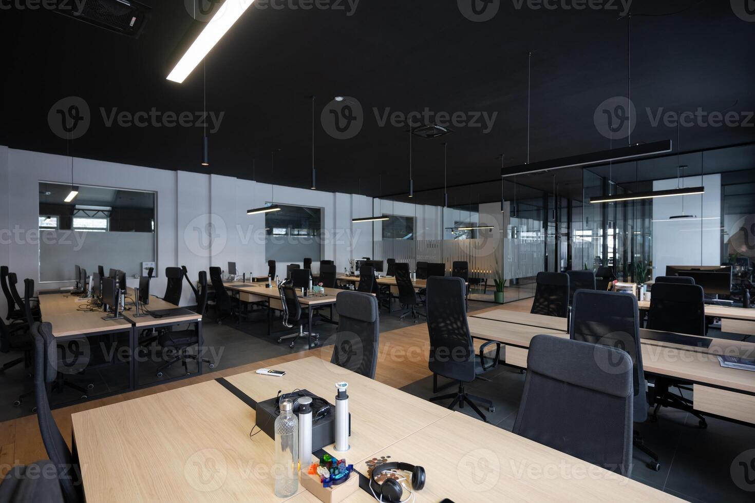 Modern business, glass-walled startup office, open and spacious workspace exudes a modern and innovative vibe, fostering a dynamic atmosphere that supports creativity, collaboration, and business photo