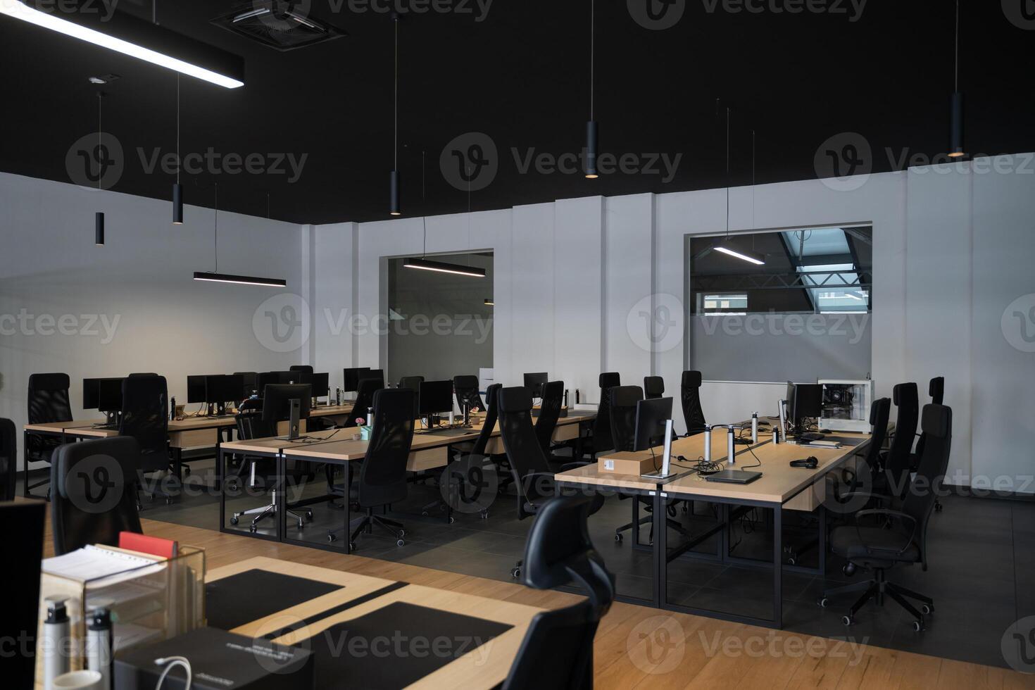 Modern business, glass-walled startup office, open and spacious workspace exudes a modern and innovative vibe, fostering a dynamic atmosphere that supports creativity, collaboration, and business photo