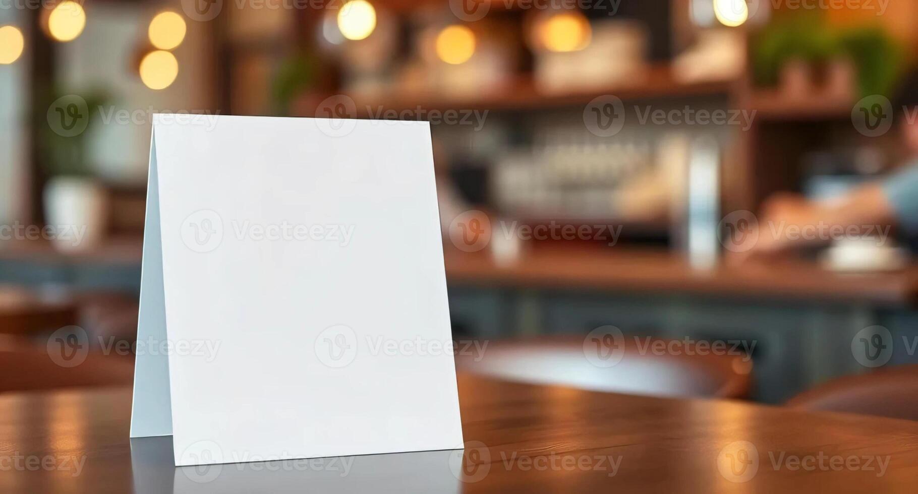 A blank menu card on a table in a restaurant photo