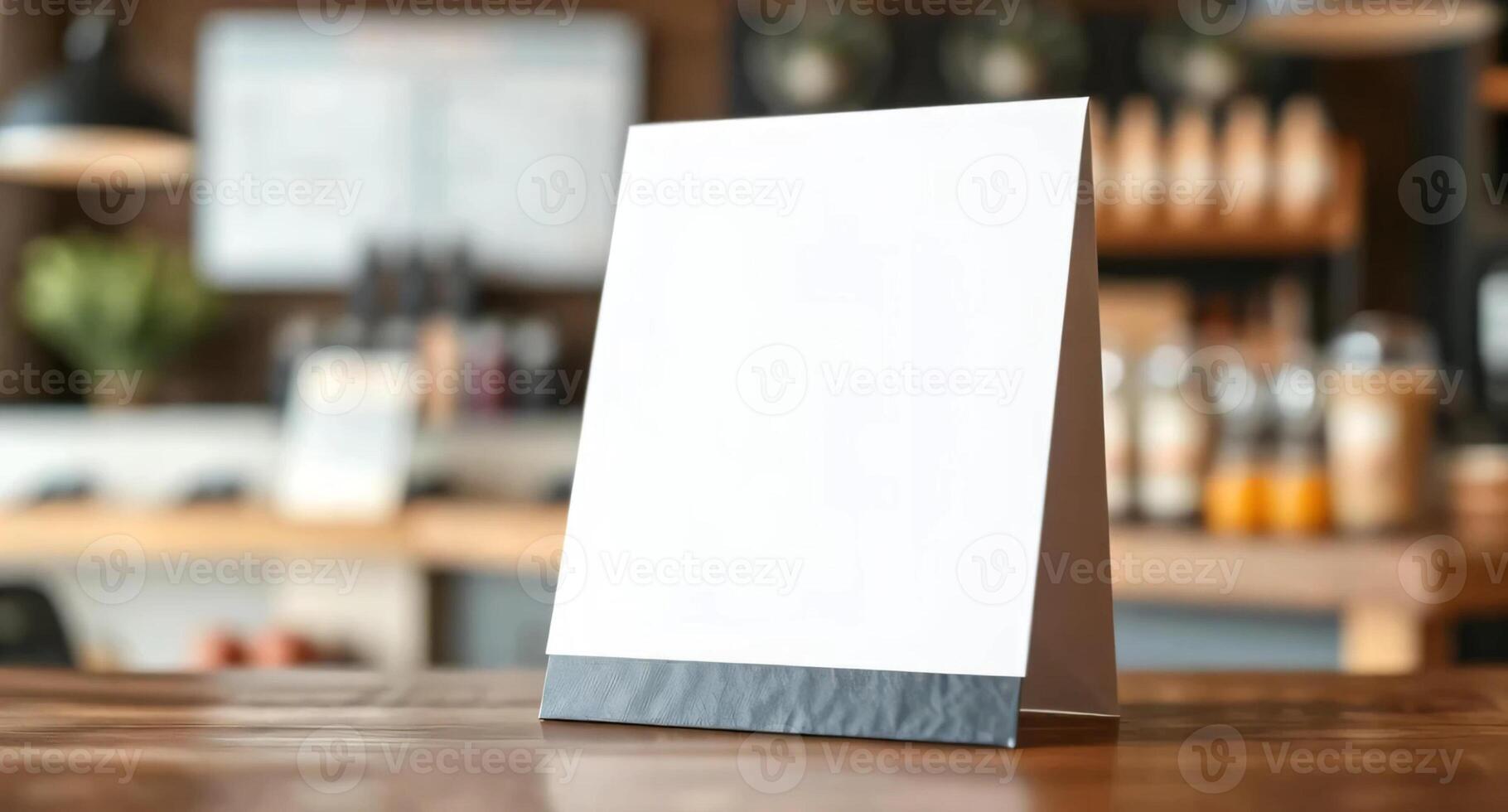 Blank menu stand on wooden table photo