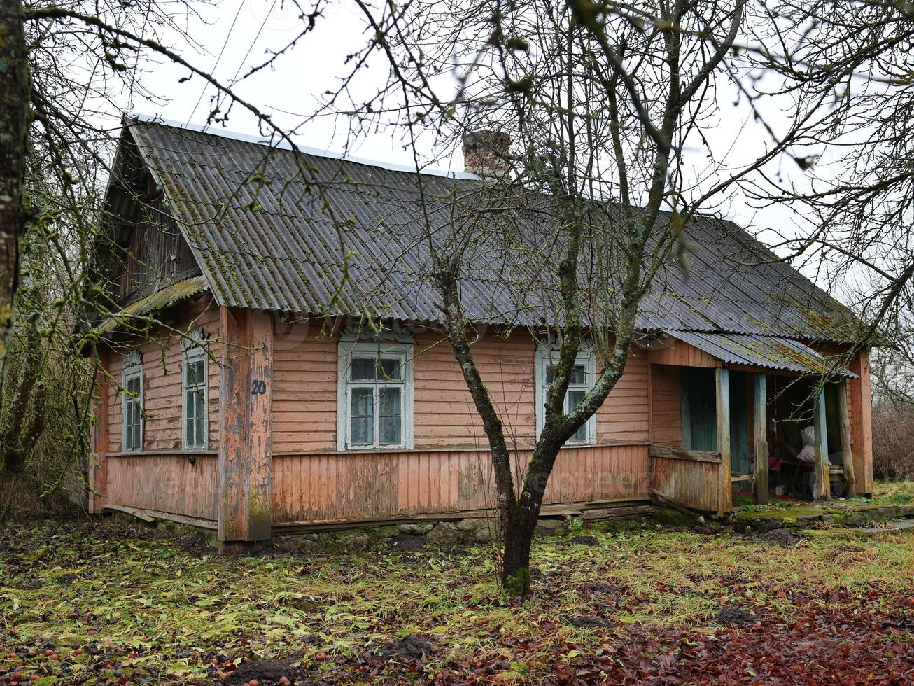 A rustic wooden house in lush surroundings, perfect for serene countryside retreats or stunning nature views photo