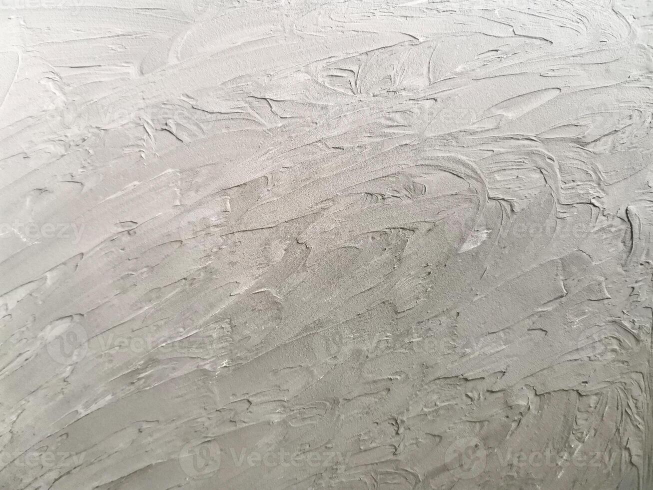 Rough textured gray background with a pronounced plaster texture. Ideal for backgrounds, interior design, graphics, and packaging photo