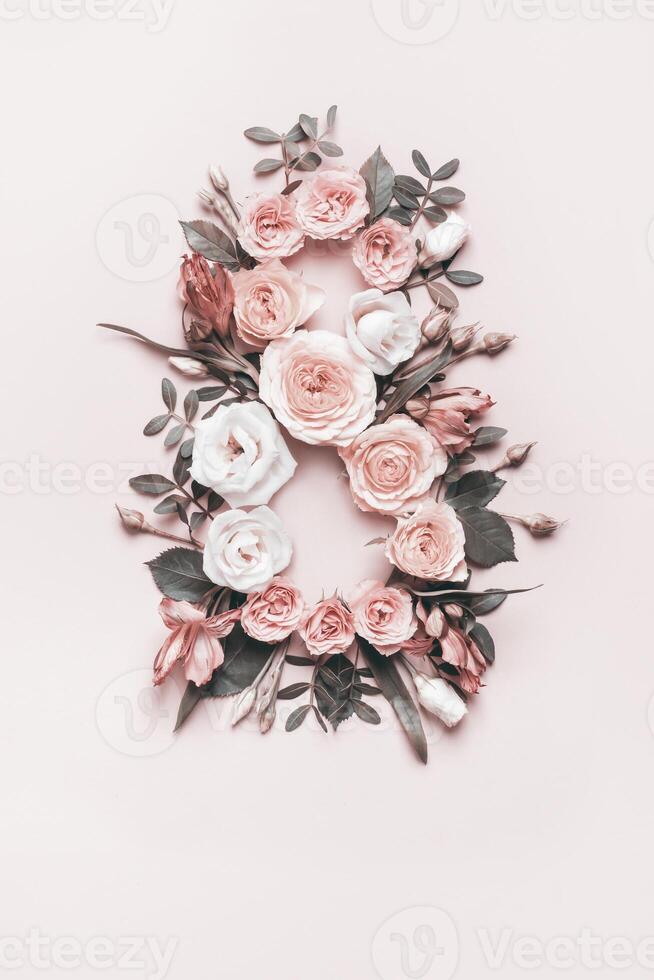 Creative layout made of rose flowers. Greeting Card Women's Day on March 8th. Monochrome tones, stylized 1920s. March 8th concept photo