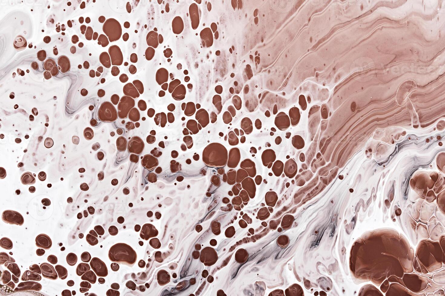 White waves and brown frothy bubbles. Abstract marble background or texture photo
