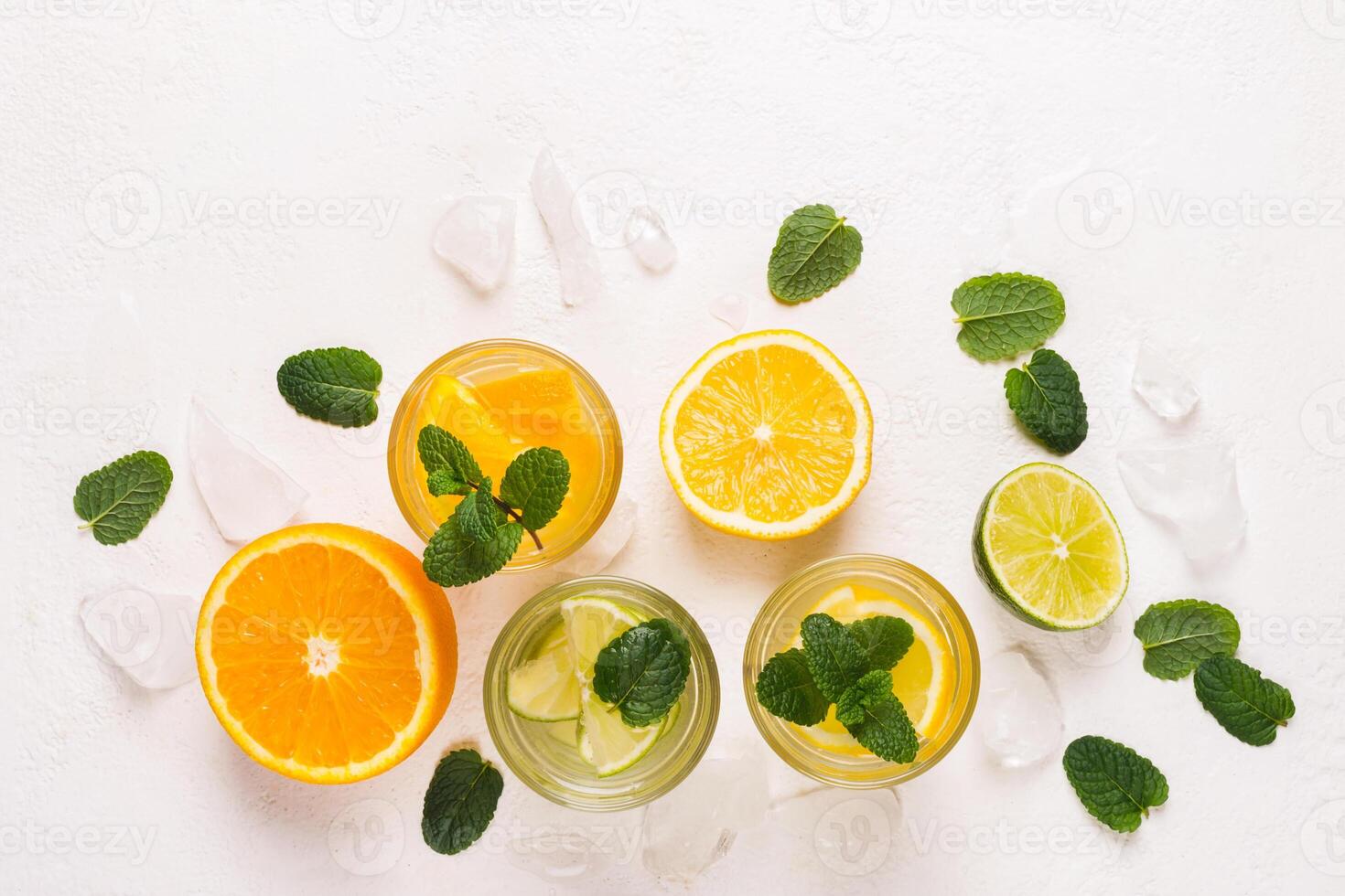 set of refreshing lemonade or detox water with citrus and mint photo