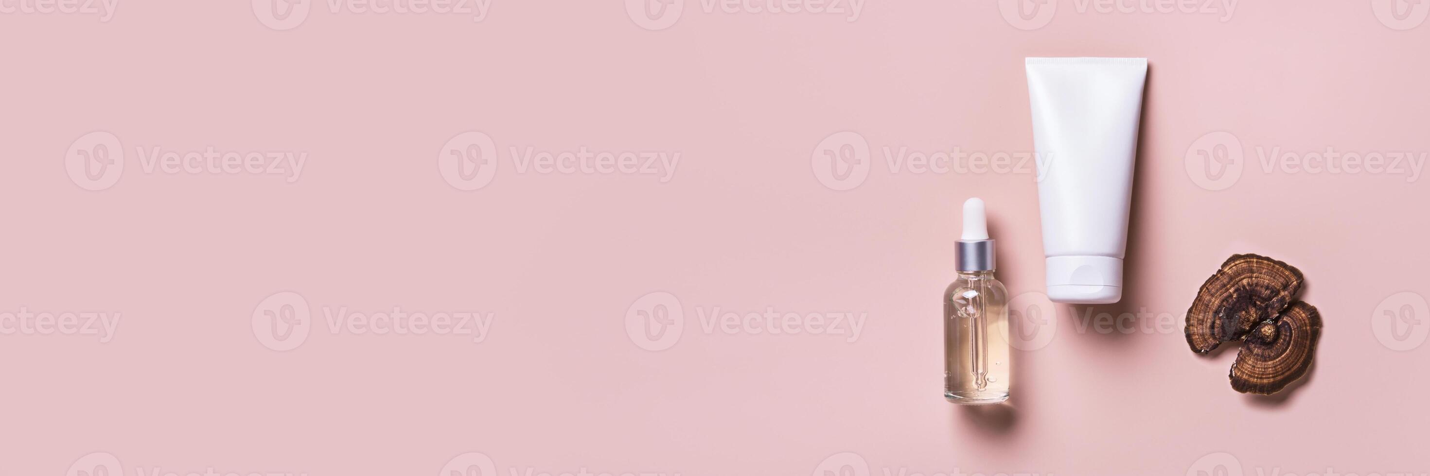 Cosmetic beauty products with mushrooms on pink banner. Mushroom skincare concept photo