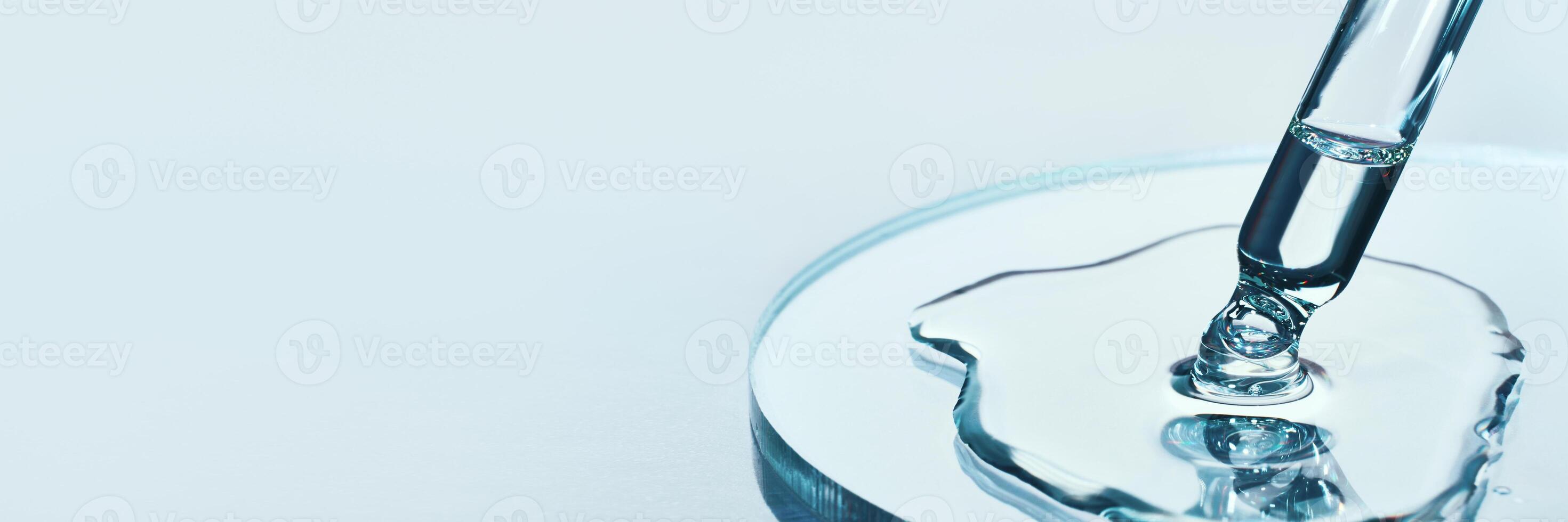 Pipette with sample of cosmetic product in petri dish on blue banner, selective focus photo