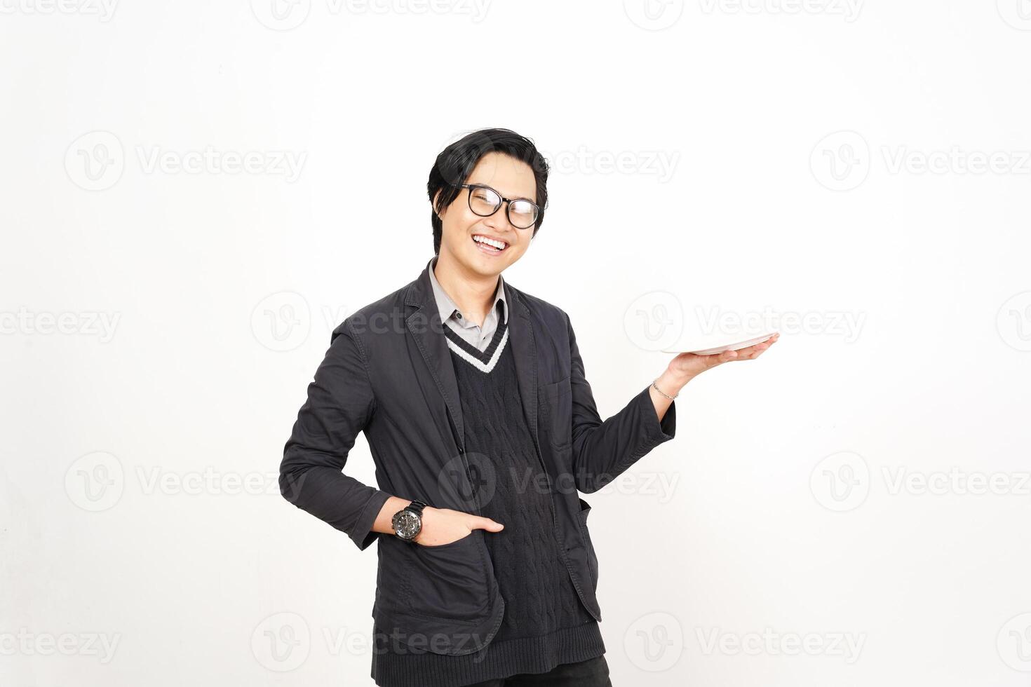 Asian man in glasses holding a white object photo