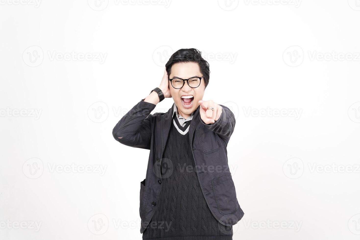 A man in glasses and a sweater pointing at something photo