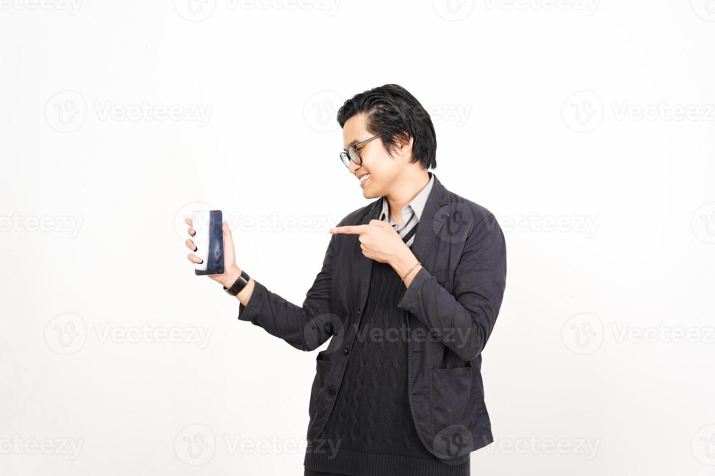 A man in a suit holding a phone photo