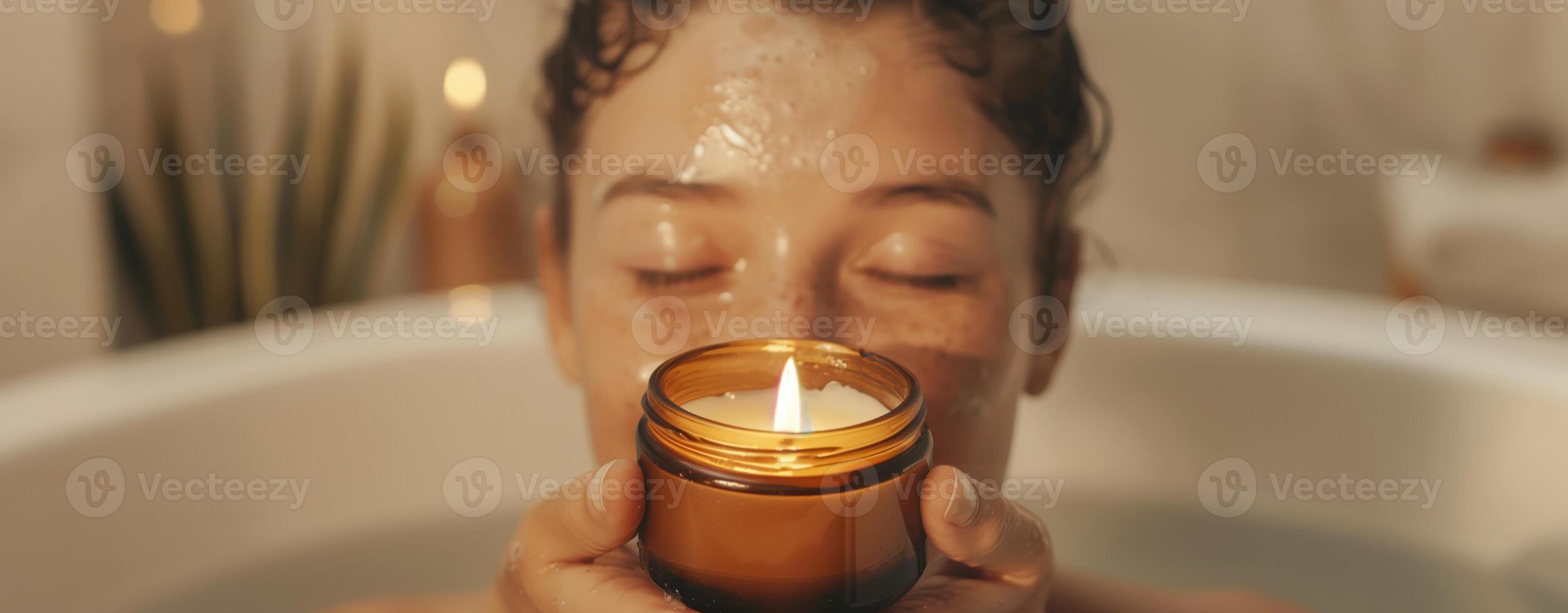 Woman enjoying relaxing in a bathtub with a lit candle, cozy spa ambiance with warm light photo