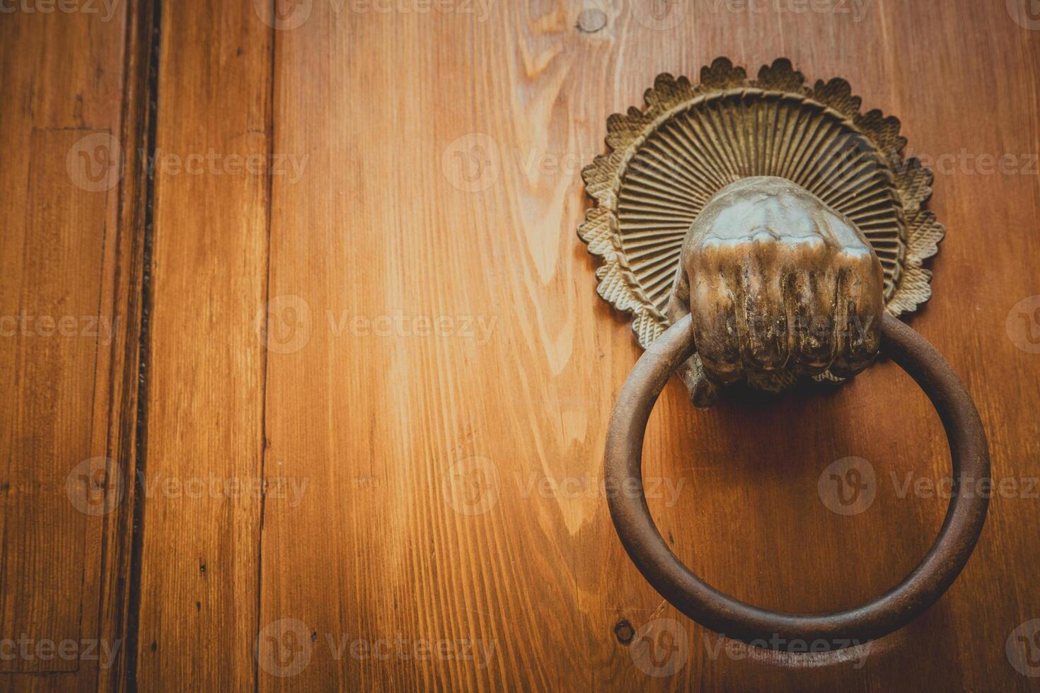 Mysterious old door entrance Dark light. Abstract concept of secret, horror and magic photo