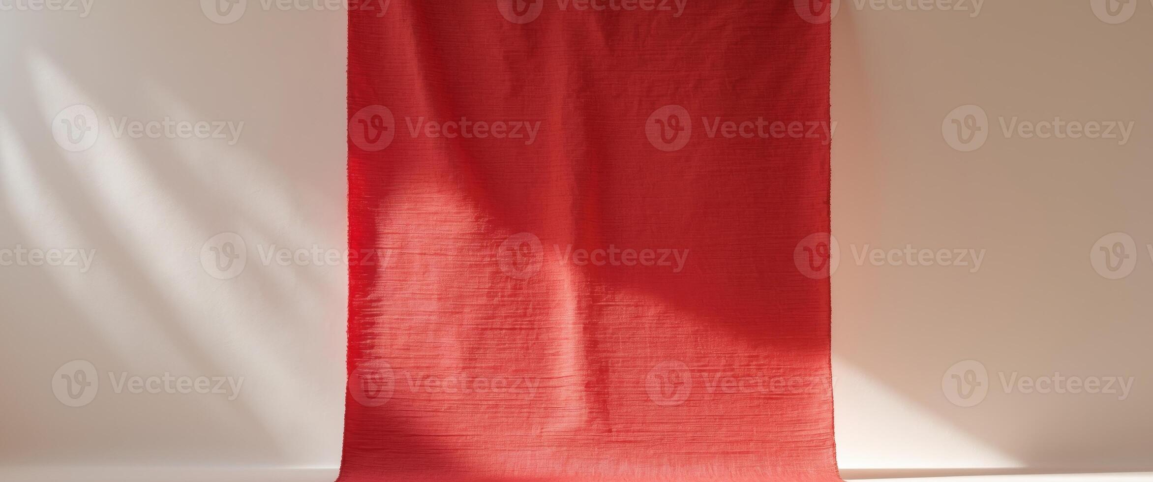 Red Textured Fabric Backdrop with Subtle Lighting for Creative Visual Composition and Empty Copy Space photo