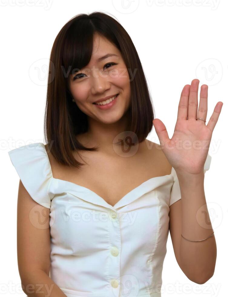 Asian woman waving her hand with a smile photo