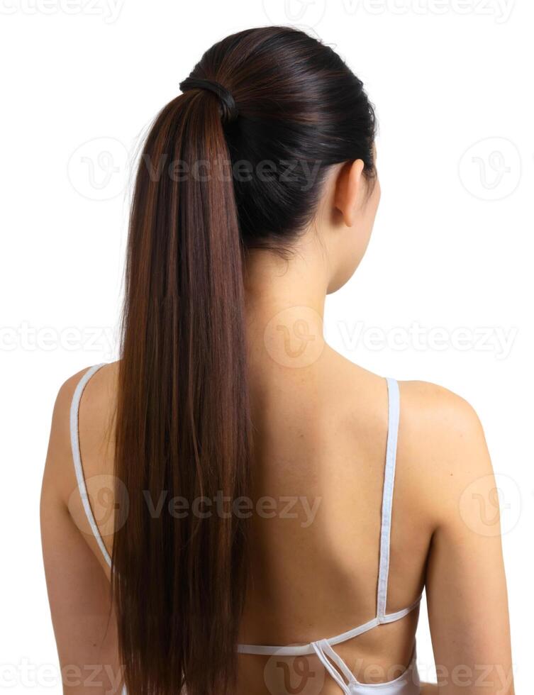 A woman with long hair in a ponytail photo