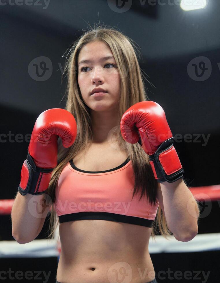 A young woman in a boxing ring photo