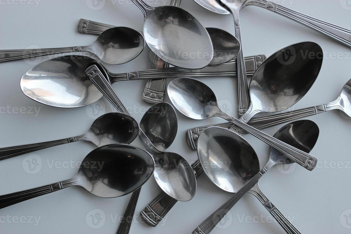 Disordered Spoons From Cutlery Set On Clean White Surface Stock Photo For Cutlery Background
