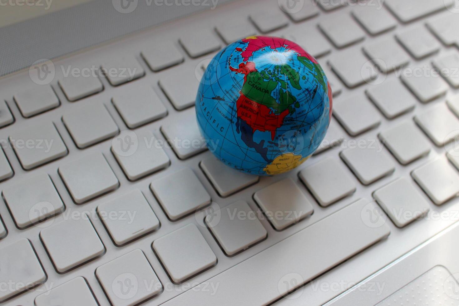 Globe Model On Blank Computer Keyboard Stock Photo. International Communication Concept Stock Image photo