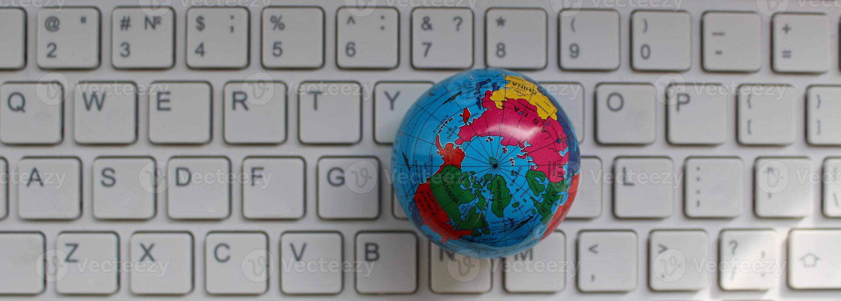 Globe Model On Computer Keypad With Latin Characters Only Top View photo